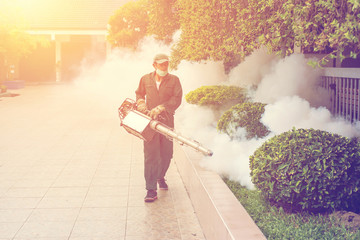 The man's fogging to eliminate mosquito for prevent spread dengue fever and zika virus