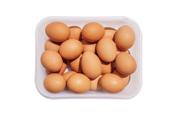 Chicken eggs in container, isolated on white background