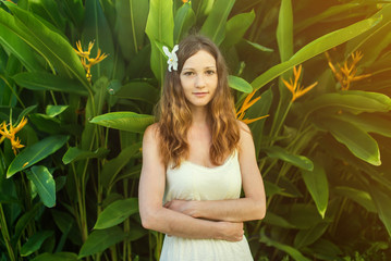 beautiful girl with Magnolia flower in hair