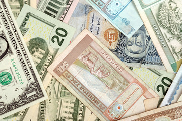 background consisting of randomly mixed banknotes from different countries
