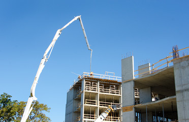 Concrete Highrise Construction site, Concrete Pumper with raised boom © birdiegal