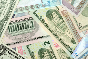 background consisting of randomly mixed banknotes from different countries