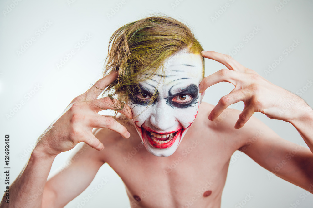 Wall mural man with halloween face art on white background