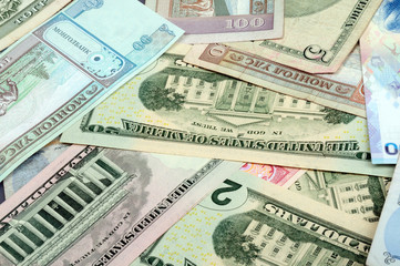 background consisting of randomly mixed banknotes from different countries