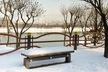 Snowy bench in the park in Chuncheon city, South Korea