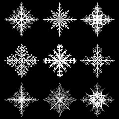 Curly white snowflakes on a black background