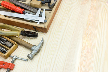 wooden toolbox with old grungy instruments and tools for hand work