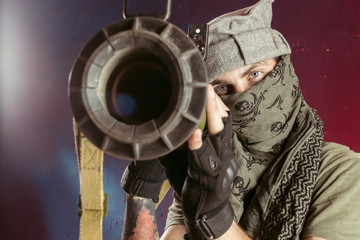 Portrait of man with bazooka gun