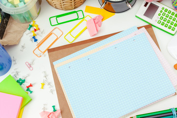 Work place of a creative person with a variety of colorful stationery objects