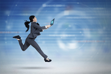 Female worker with laptop runs in cyberspace