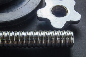 Heavy dumbbells for workout on black background