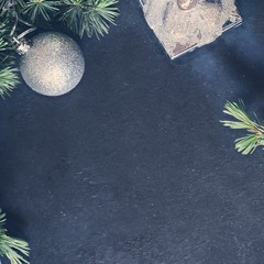 Christmas baubles on black. Square