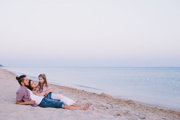 happy family enjoying life on the beach