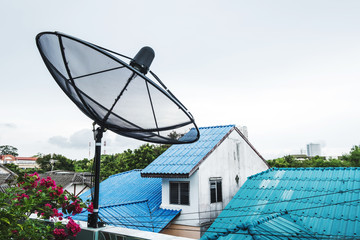 Home Satellite Dish on a roof top in rural area