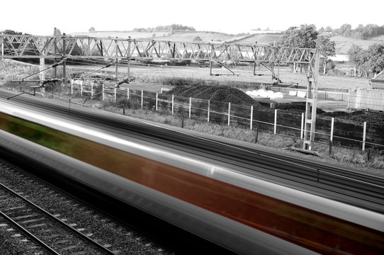 Abstract image of a passenger train travelling at high speed
