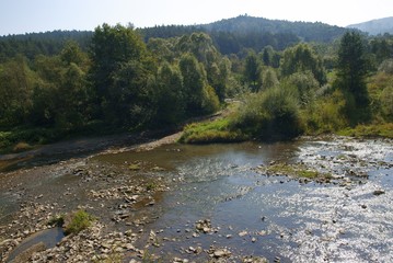 Wisloa river in Krempna near a dam