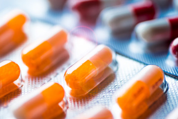 Colorful medical pills, with lens flare