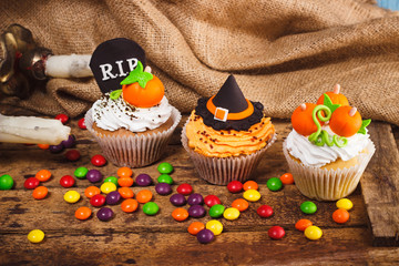 Halloween cupcakes with colored decorations