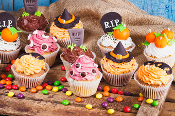 Halloween cupcakes with colored decorations