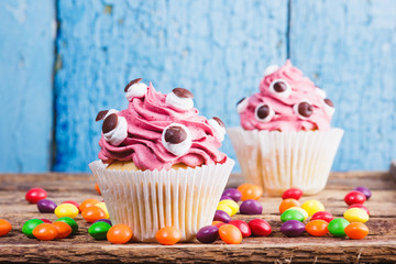 Halloween cupcakes with colored decorations