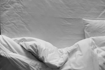 Top view of bedding sheets and pillow