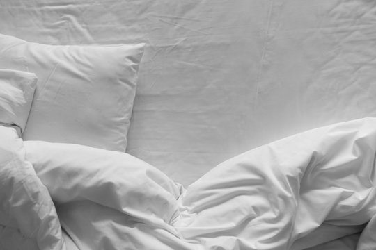 Top view of bedding sheets and pillow