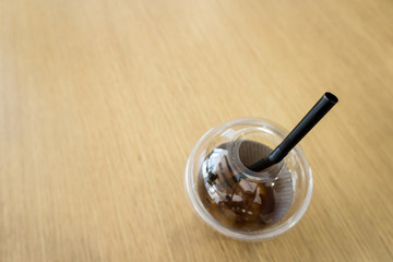 A cup of coffee on wooden background