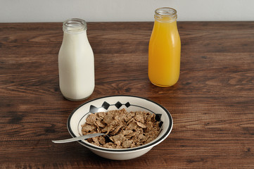 Breakfast with cereal, milk, orange juice