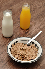 Breakfast with cereal, milk, orange juice