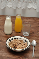 Breakfast with cereal, milk, orange juice