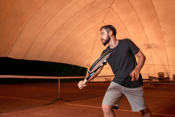 young sportsman playing tennis