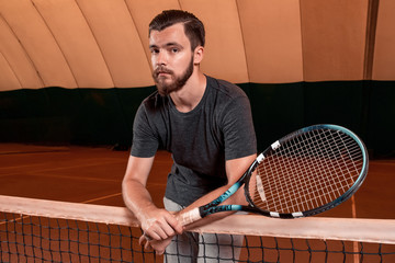 young sportsman playing tennis