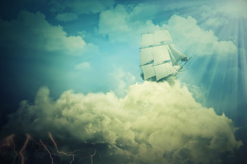 Air floating boat. Surreal screensaver with an old ship sailing in the clouds