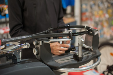 Stringing Machine. Tennis stringer doing racket stringing in his workshop