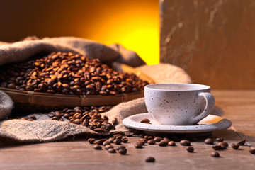 Cup of black coffee and  beans