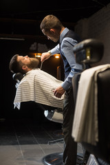 Grooming beard in a Barbershop