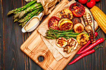 grilled vegetables on wooden table