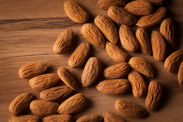 Almonds on wooden background