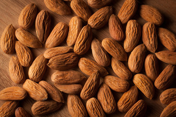 Fototapeta premium Almonds on wooden background