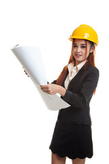 Asian engineer woman with blueprints.