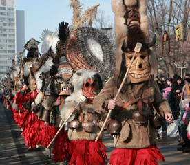 Obraz premium PERNIK, BULGARIA - JANUARY 30, 2016 - Masquerade festival Surva in Pernik, Bulgaria. People with mask called Kukeri dance and perform to scare the evil spirits