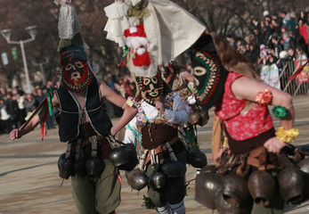 PERNIK, BULGARIA - JANUARY 30, 2016 - Masquerade festival Surva in Pernik, Bulgaria. People with mask called Kukeri dance and perform to scare the evil spirits