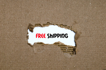 The word free shipping appearing behind torn paper
