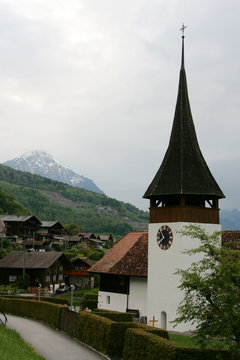 Clock tower of rural church in Leissigen, Switzerland