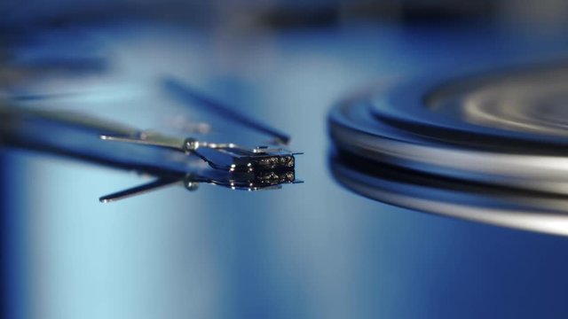 static macro shot of the flying hard disk head while reading and writing data from the platters