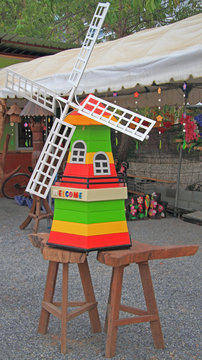 Decorative wooden windmill in the garden