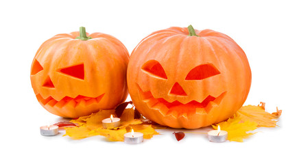 Halloween pumpkin head jack lantern with burning candles isolated on white