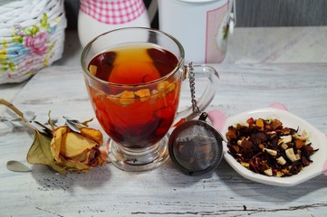 hot tea with fruit and rose petals and honey - an alternative to antibiotics - selective focus
