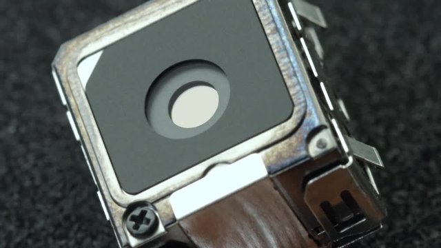 close up shot of a turning micro spy camera zoom out