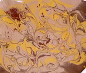 Liquid gold marbled swirling pattern
